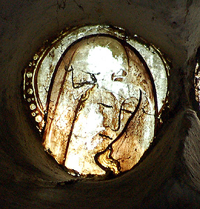 Fragment of stained glass in the north aisle east window May 2011